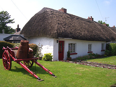 Thatched house with tip-up cart
